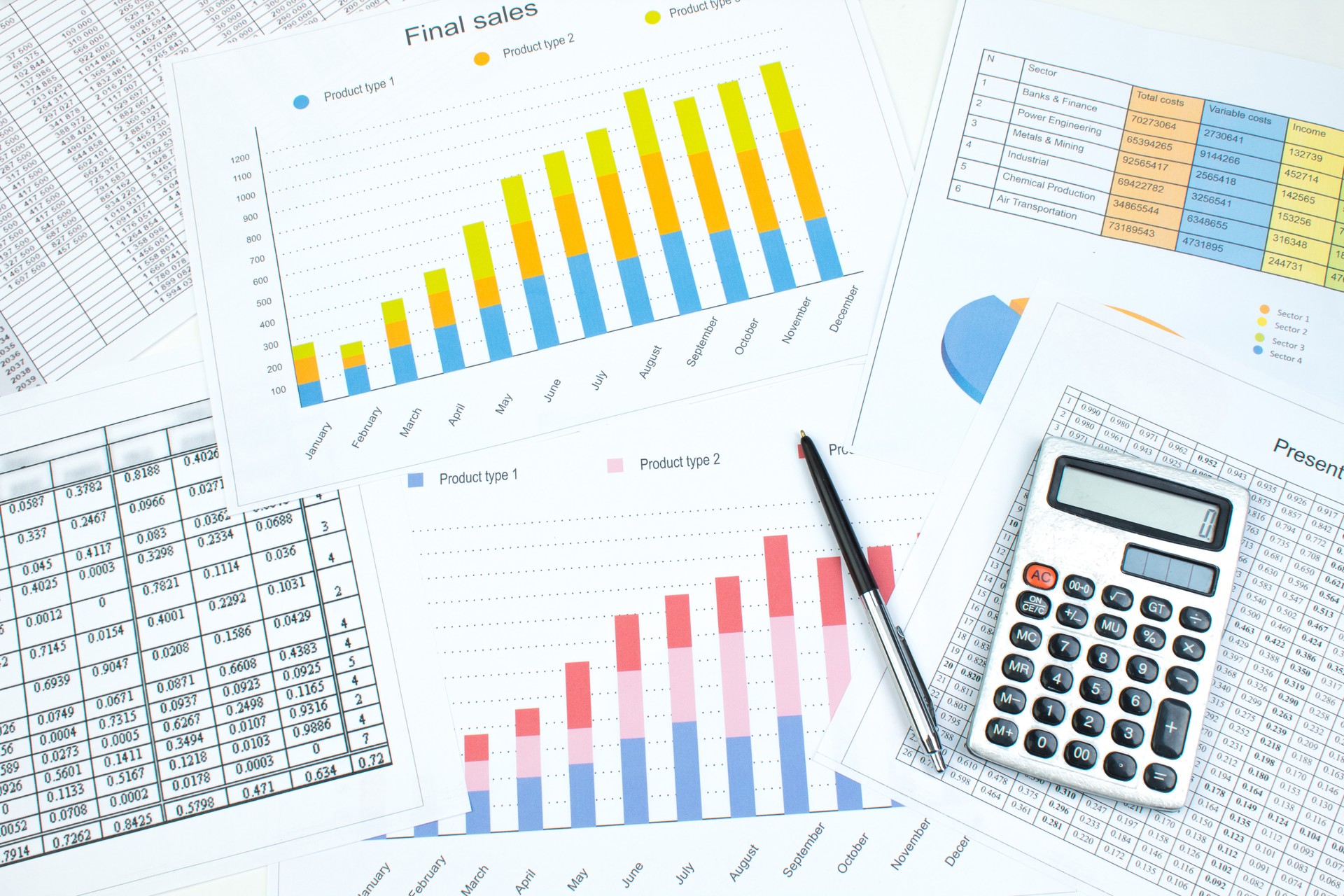 Financial printed paper charts, graphs and diagrams on the table. Top view